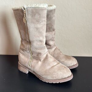 Women’s zip up boots. Size 8. Cozy inside lining. Gold zipper. Only worn once!